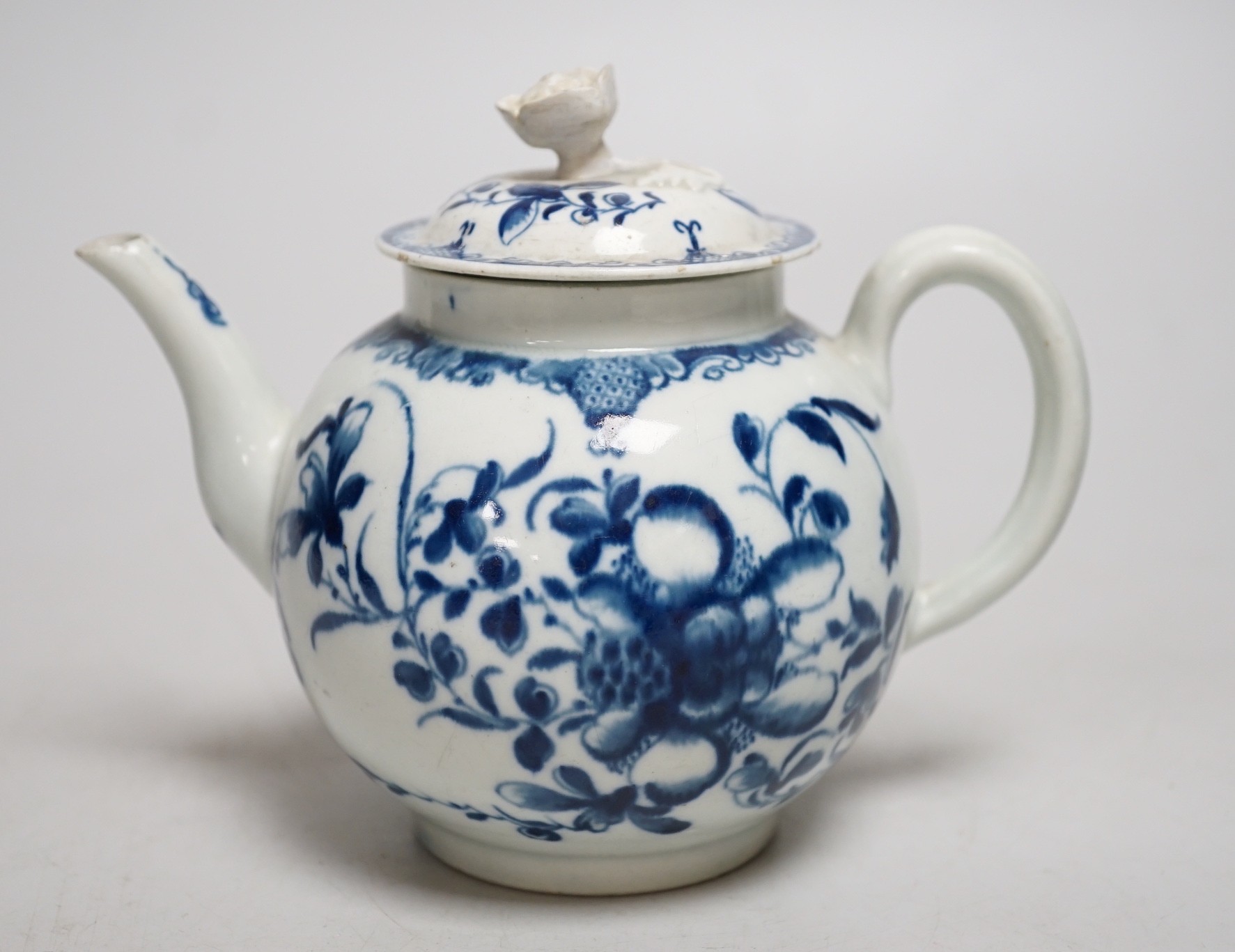 A Worcester Mansfield pattern teapot and cover with flower decoration and finial. 13cm tall